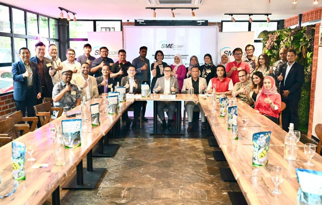 engaging in a discussion with industry leaders and entrepreneurs.